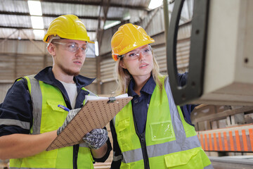 Serious Caucasian Engineers Reviewing Control Panel Data in Factory