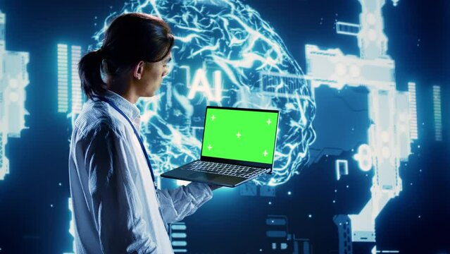 Programmer using chroma key laptop to implement artificial intelligence parallel processing. Admin working on green screen device, enabling AI systems to process machine learning data