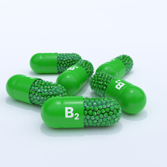 Vitamin B2 With Green Capsules, Granules and White Background