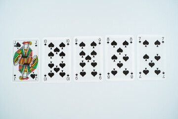 Straight flush playing cards isolated on white background.