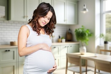 Happy smiling pregnant woman at home