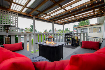 Deck with fire pit, outdoor furniture, and with a beautiful day setting