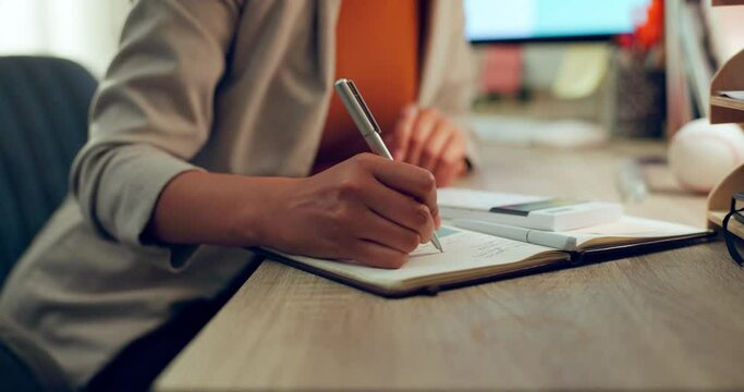 Accounting, hand and calculator or writing in a notebook for finance budget, cost or tax math. Closeup of an accountant woman at desk with notes for calculation, bookkeeping or investment in business