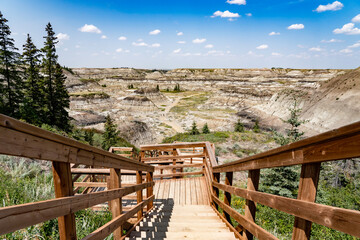 Staircase leading down into Horseshoe Canyon overlooking badlands and prehistoric lands near Drumheller Alberta Canada.
