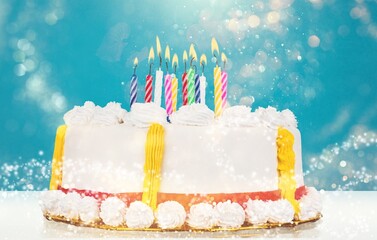 colored tasty sweet birthday cake with candles