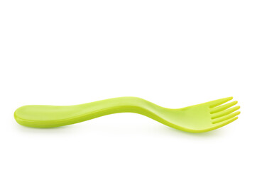Green plastic fork for baby isolated on white background