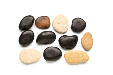 Fototapeta na wymiar Many pebble stones on white background