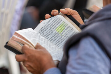 A man reading the Bible in Spanish.