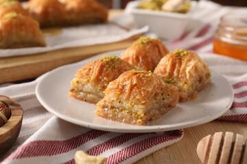 Delicious sweet baklava with pistachios on table, closeup