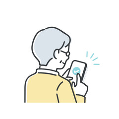 スマホを操作するシニア男性