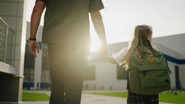 Young Father And His Little Daughter Going Over School Yard In Sunny Morning, Cheerful Schoolgirl