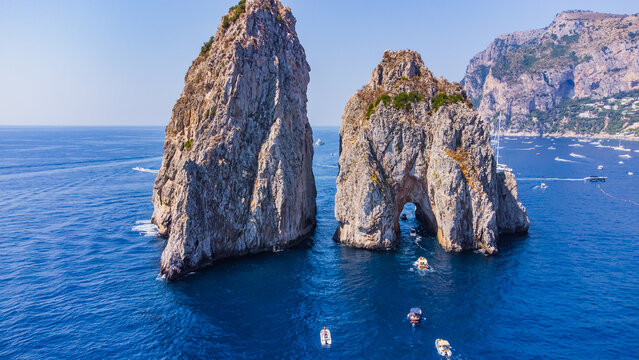 The Amalfi Coast is a breathtaking stretch of coastline in southern Italy, known for its vertiginous cliffs adorned with colorful villages, turquoise waters, and lush terraced gardens. 