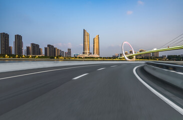 The curved approach bridge of the highway overpass leading to the city
