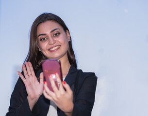 beautiful caucasian woman in black suit commucate live social with collegue outside building in city with copy space