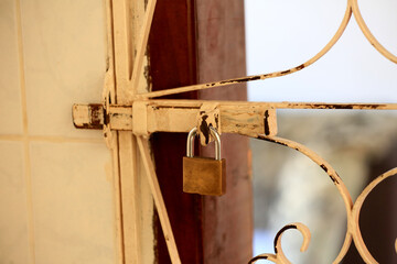 salvador, bahia, brazil - august 26, 2023: Padlock on the gate of a residence in the city of Salvador