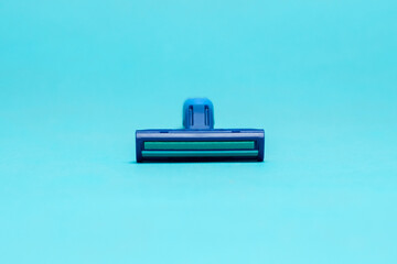 Blue razor blade with blue background