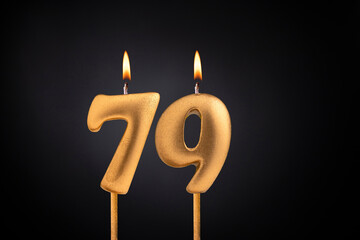 Birthday candle number 79 - Birthday celebration on black background