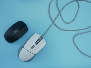 white wired mouse and wireless black mouse