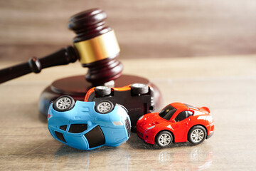 Bangkok, Thailand March 15, 2023 Car accident lawsuit and insurance, Judge hammer with car model.