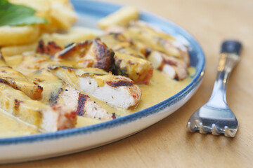 butter chicken, curry of spicy chicken with rice.