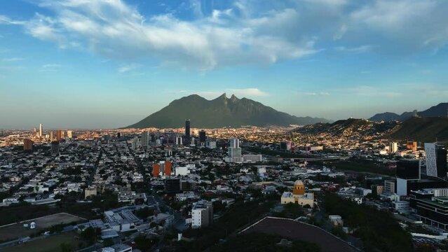 Aerial view rising over the Bishopric Hill,  sunny evening in Monterrey, Mexico