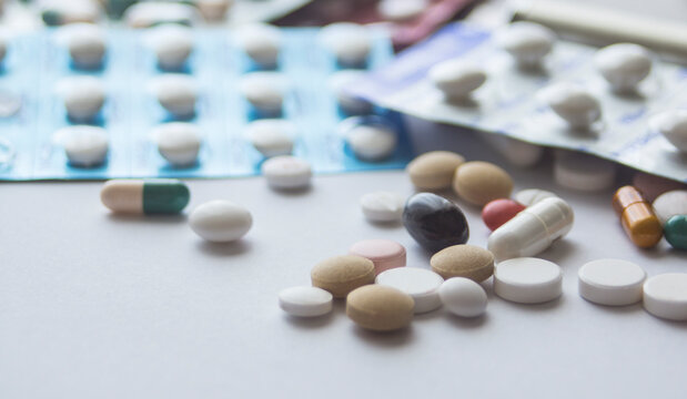Several pills and capsules on the table.  medicine. drugs
