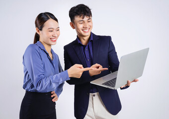 Fototapeta na wymiar Photo of two young Asian business people on white background