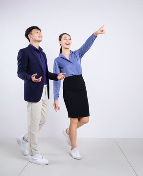 Photo Of Two Young Asian Business People On White Background