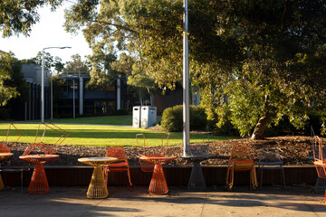 Outdoor Cafe Chairs Sit in Afternoon Light