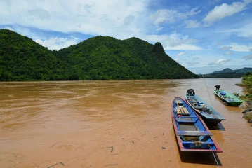 Fotobehang fisherman boat on Maekhong river Thailand Laos border in Chiang Khan © Cesur