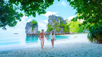 Koh Hong Island Krabi Thailand, a couple of men and women on the beach of Koh Hong, a tropical...