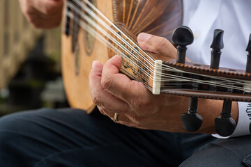 Man playing oud. 