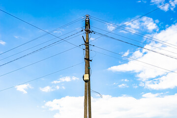 Power electric pole with line wire on colored background close up