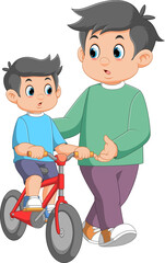 Boy learning to ride a bicycle with his father
