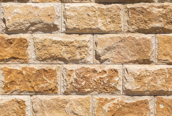 Fototapeta premium old red stone walll close up