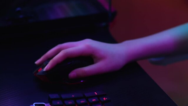 Close Up Of Pro Cyber Sport Gamer Play Game With Rgb Keyboard And Mouse
