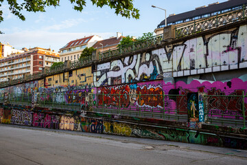 View of graffiti on the Danube Canal embankment in Vienna