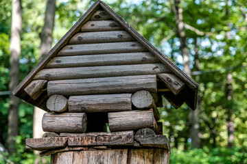 Wooden birdhouse for birds in the park.