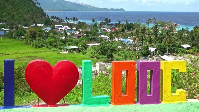 I Love Looc. A welcoming sign as you approach the fishing village and tourist beach of Looc, Surigao Del Norte. Philippines.