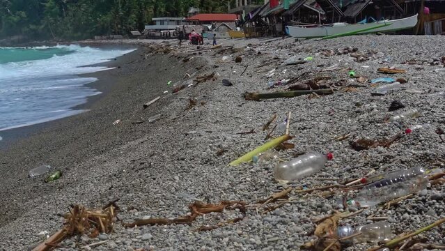 Looc beach, Surigao Del Norte, Philippines - 08-26-23. Hundreds of plastic bottles litter the beaches. A common site in many areas of the Philippines and a true environmental crisis.