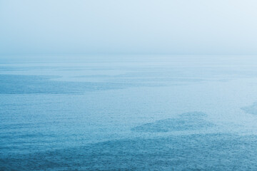 Fototapeta na wymiar Summer shower rain at Croatian Adriatic sea shoreline, minimalistic landscape background