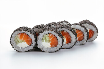 japanese sushi rolls with salmon and black sesame on a white bac