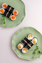 classic japanese sushi rolls with salmon on a plate