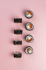 japanese sushi rolls with salmon and black sesame seeds