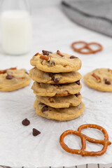 Stack of Chocolate Chip Pretzel Cookies with glass of milk