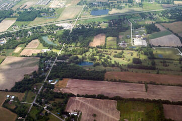 Looking down from airplane window flying over rural mid-west