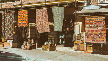 Bergama carpets. Antique shop at the street of Bergama. Travelling and shoping, traditional turkish sovenirs. Bergama, Turkey (Turkiye)
