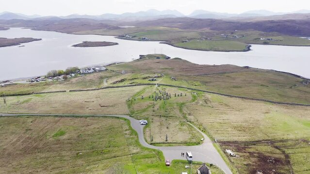 Moving drone shot of the ancient Callanish Standing Stones on the Isle of Lewis, part of the Outer Hebrides of Scotland. The stones are neolithic, first erected more than 4 millennia ago.