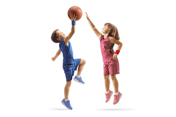 Little boy and girl playing basketball