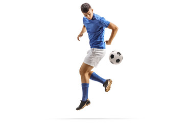 Football player kicking a ball with back heel